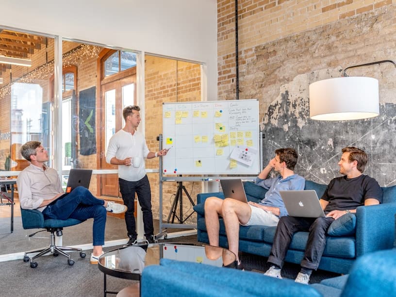 Team reviewing tender updates in a meeting room